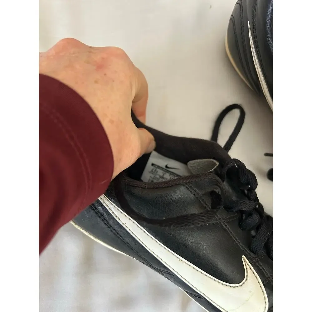 Nike black and white cleats size 2.5